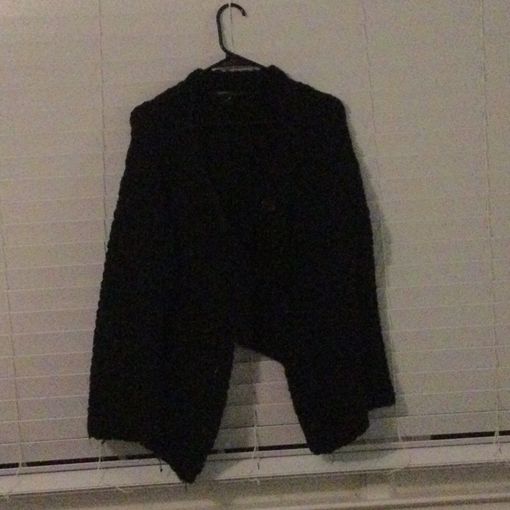 Over-sized, large button cardigan.